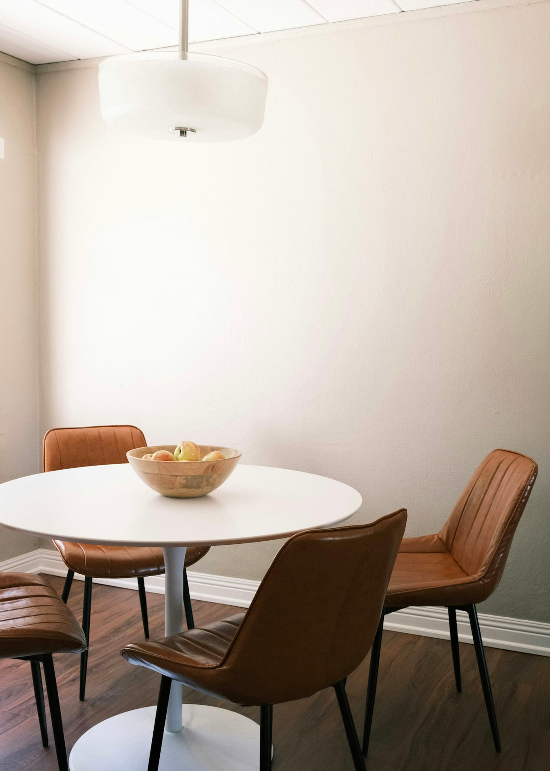 brown wooden round table with chairs