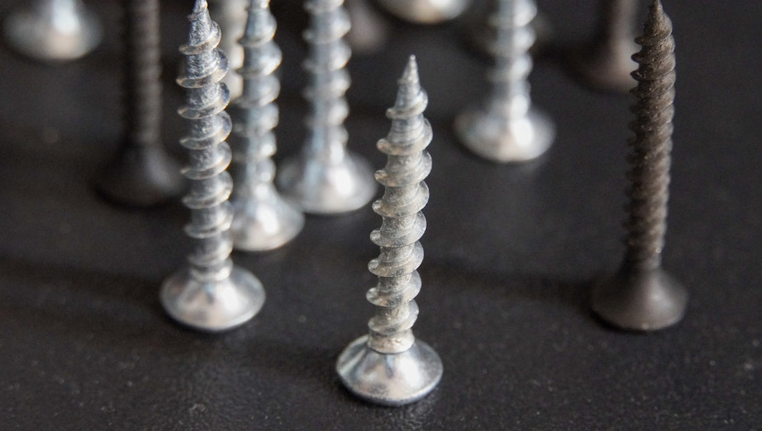 a bunch of screws that are on a table
