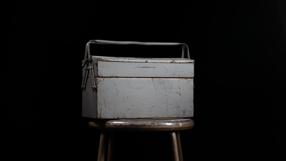 a metal box sitting on top of a stool