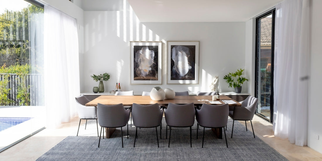 a dining room table with chairs around it