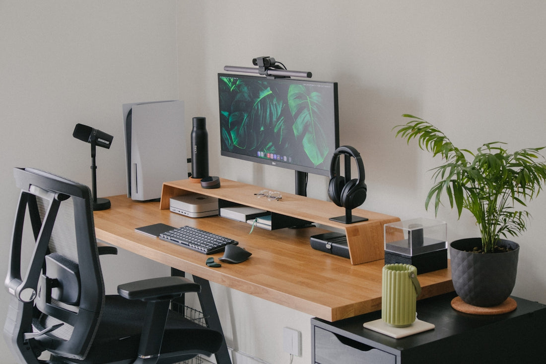 a computer desk with a monitor and keyboard
