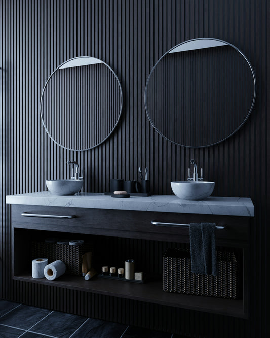 Modern bathroom vanity with two sinks and mirrors.