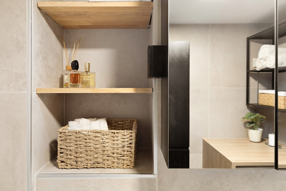 A bathroom with a sink, mirror and shelves