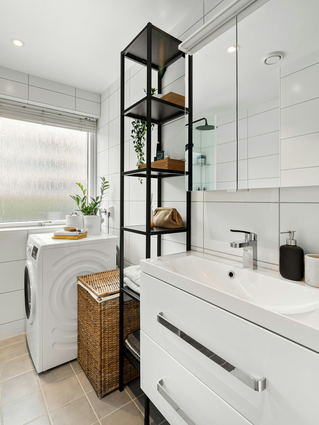 A bathroom with a washer and dryer in it