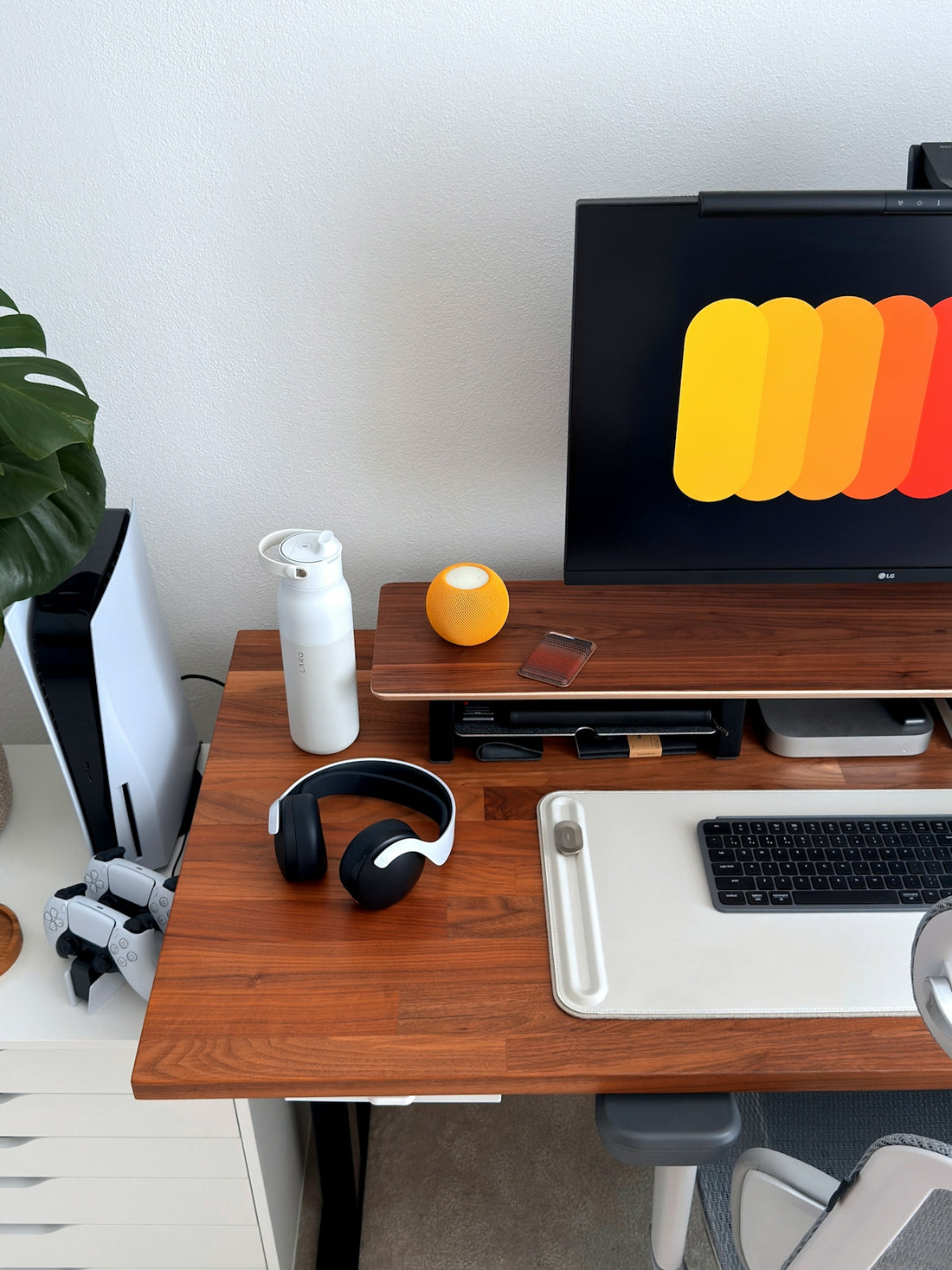 Modern desk setup with computer and headphones