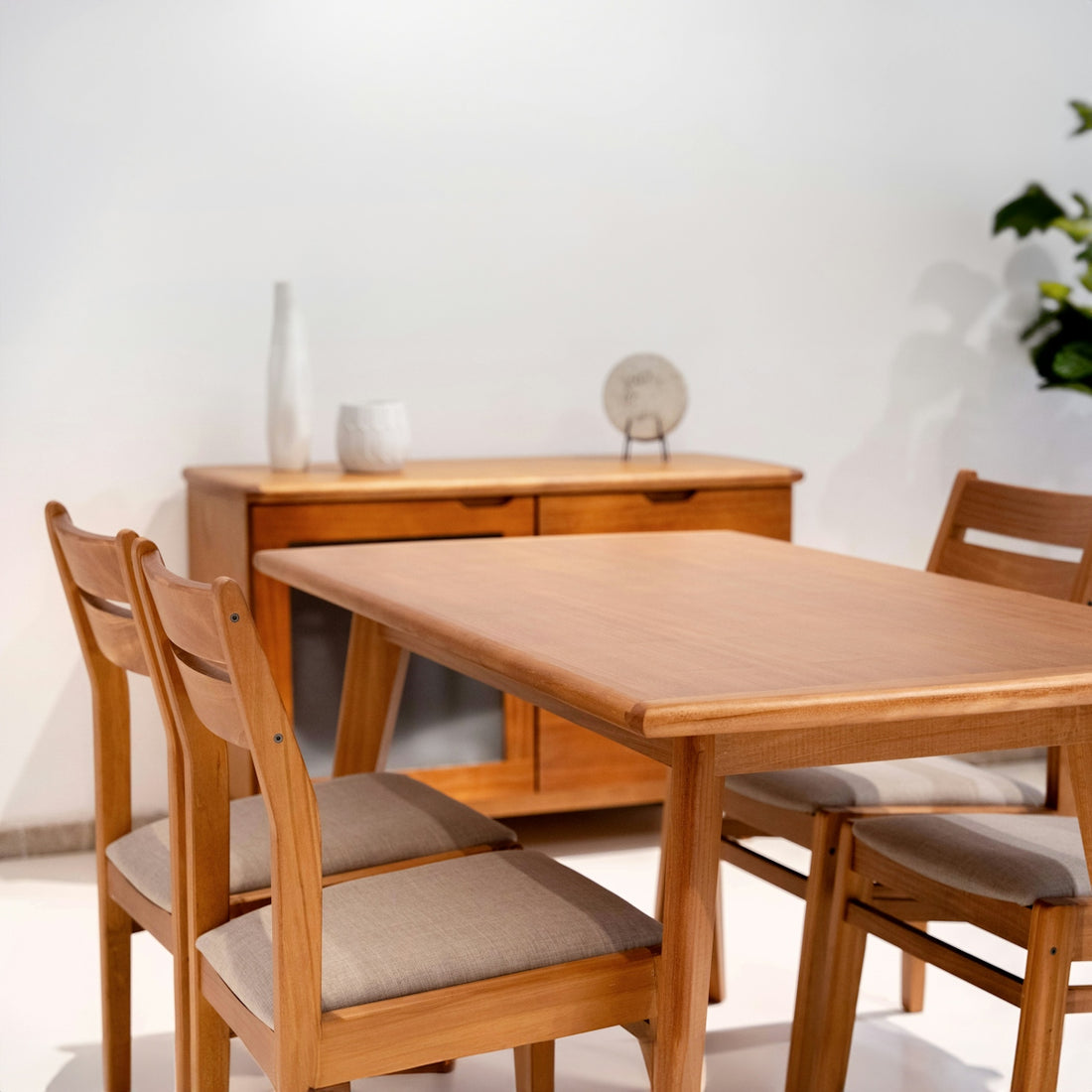 Wooden dining table with chairs and chairs in a room