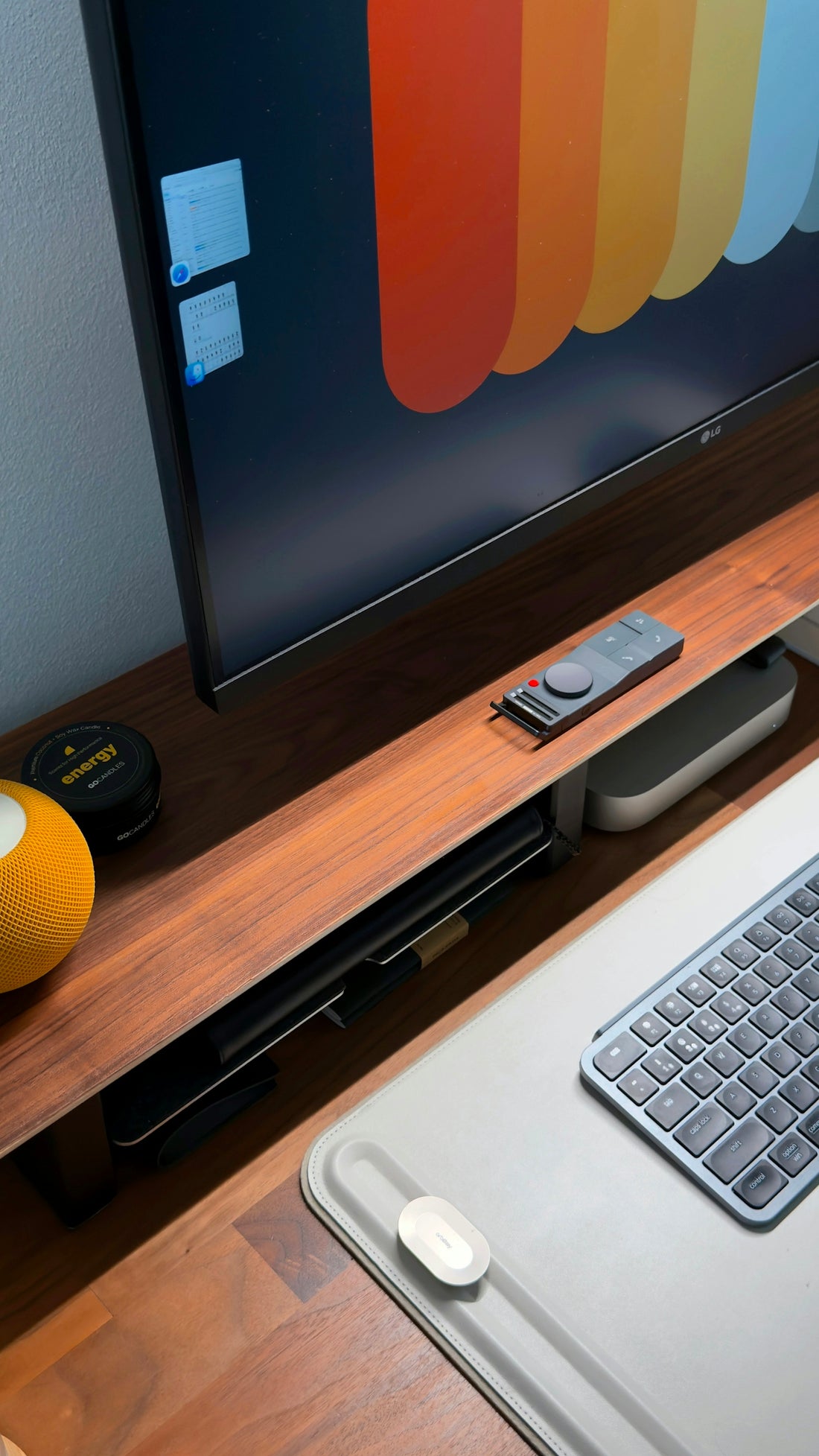 Modern desk setup with computer and accessories.