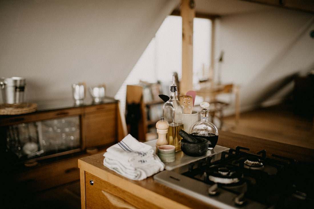 Kitchen counter with cooking ingredients and utensils.