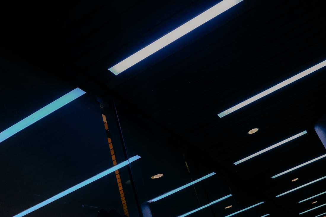 Modern ceiling lights with blue and white accents.