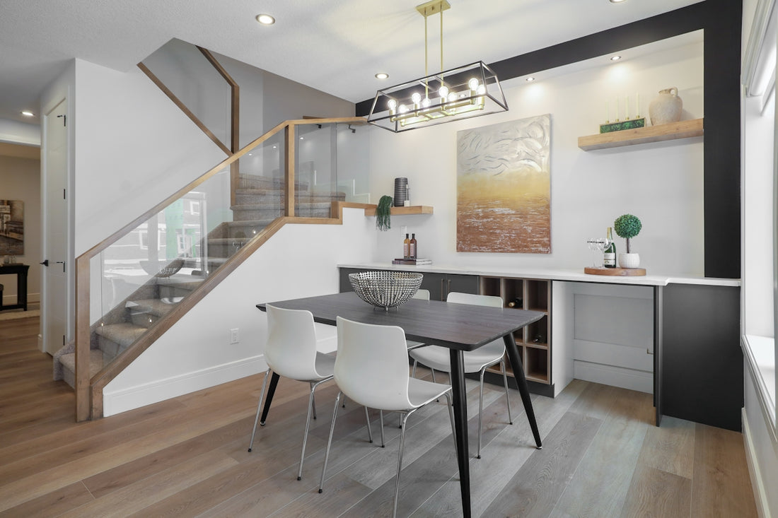 Modern dining area with a table and chairs.