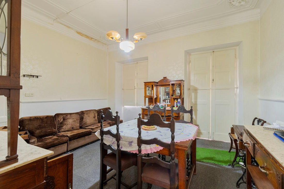 Dining room with antique furniture and sofa