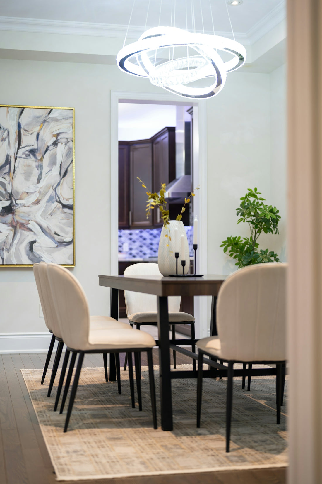 A modern dining room with a table and chairs.