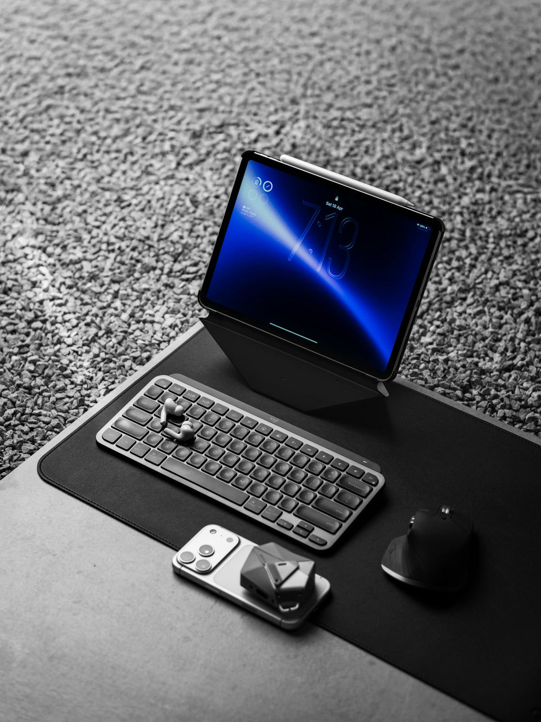 Tablet, keyboard, and mouse on a desk.