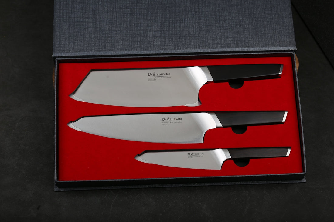 A set of three kitchen knives in a box