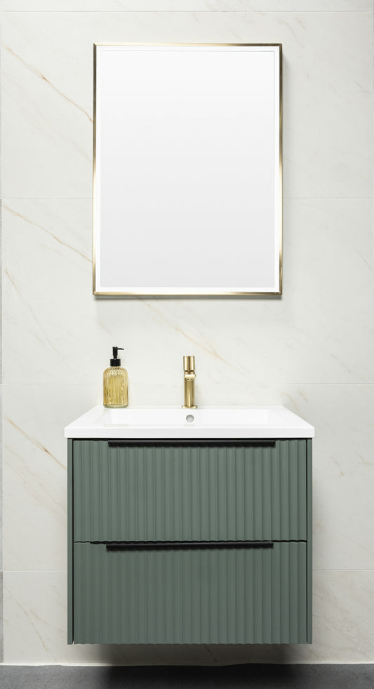 Bathroom with green vanity, gold faucet, and mirror.